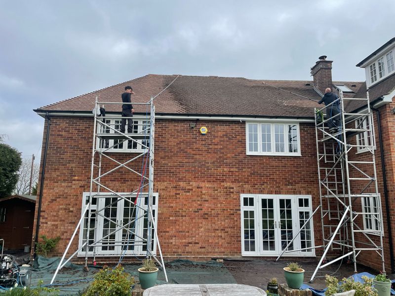 Roof cleaning carried out safely from scaffold towers by The Roof Moss Cleaners in Bishop's Waltham